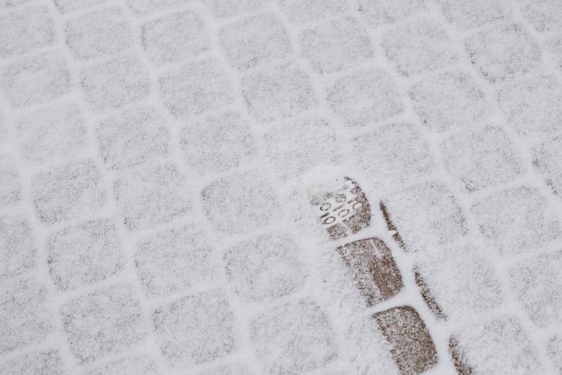 Snow-covered sidewalk in winter